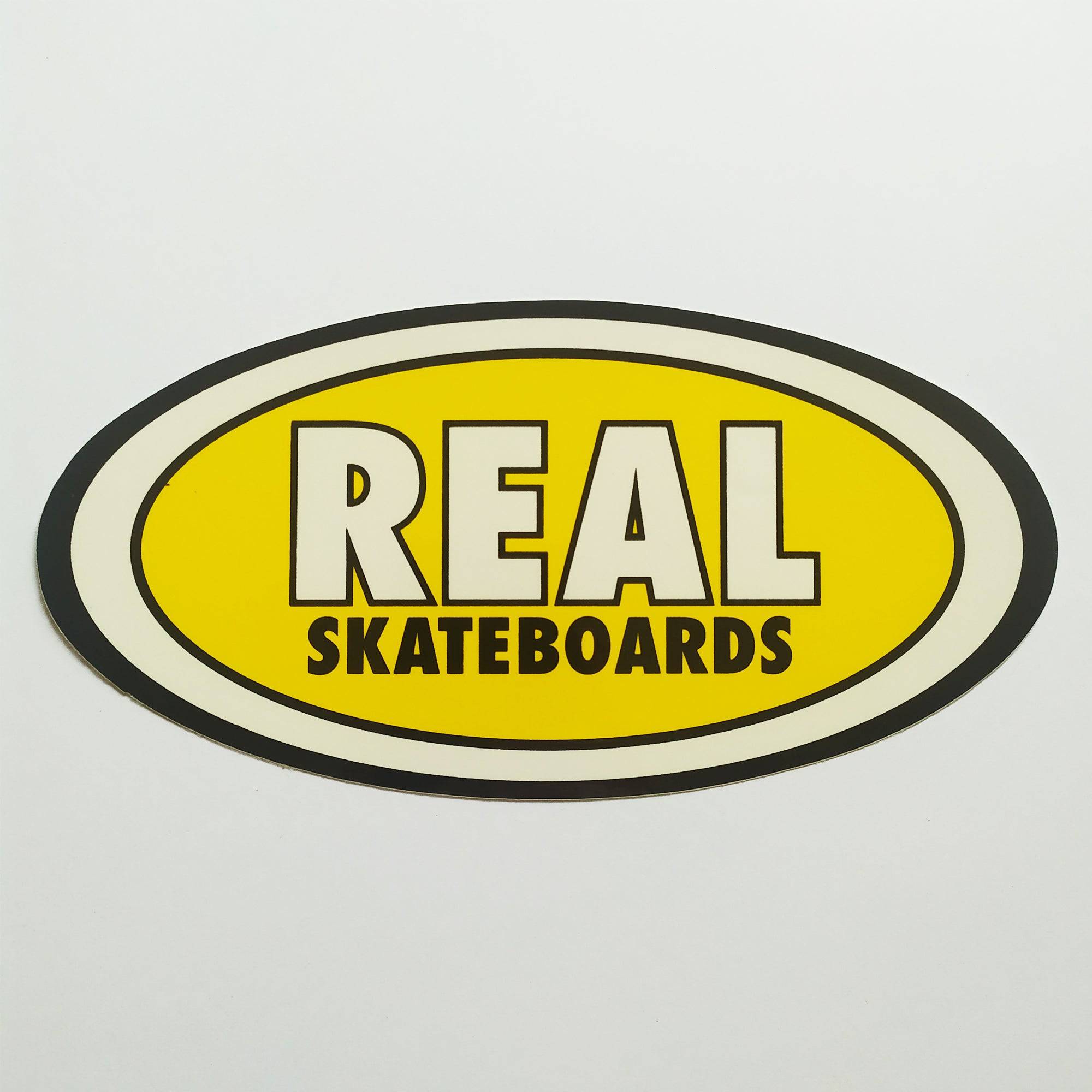 Real Skateboards Oval Sticker - yellow medium - SkateboardStickers.com