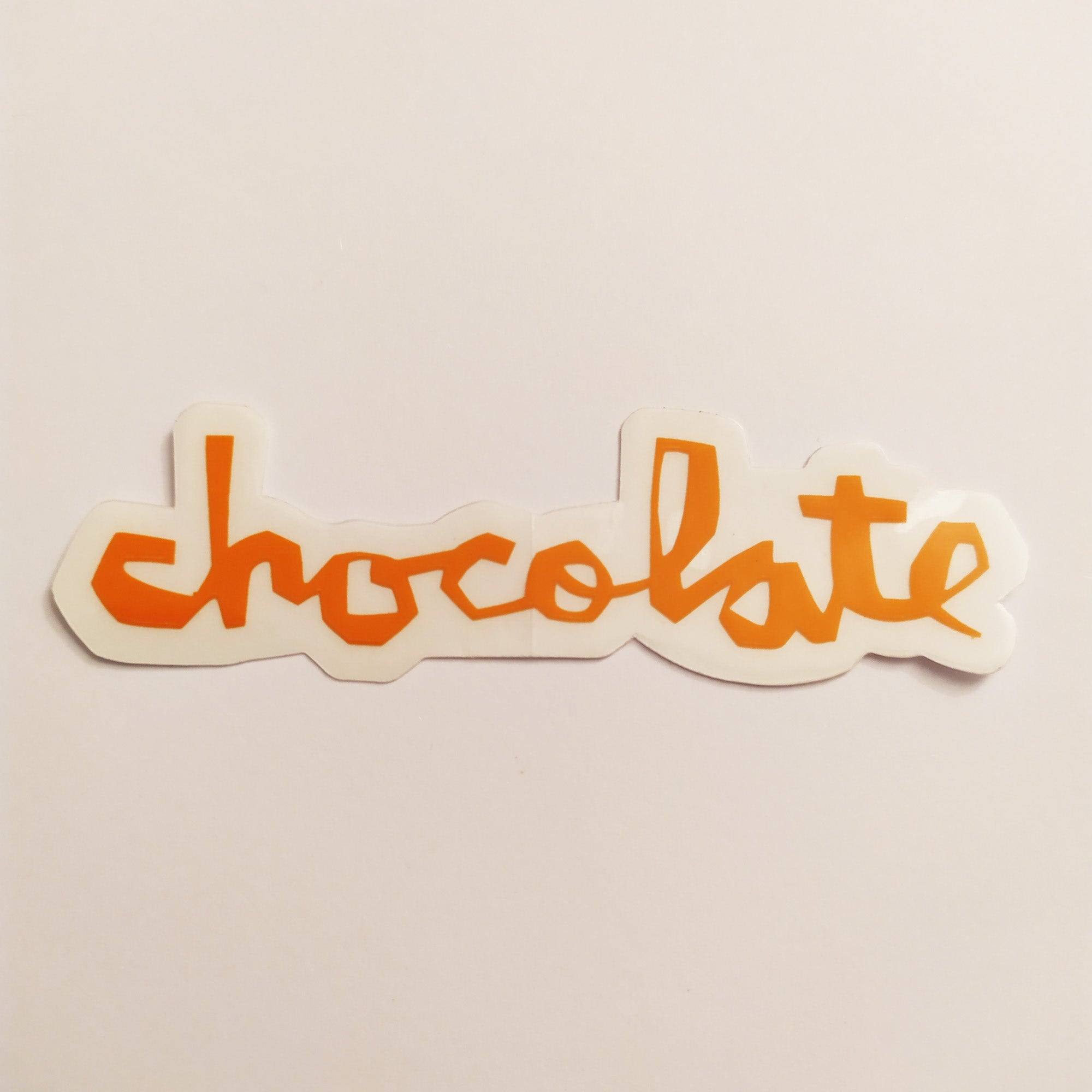 Chocolate Chunk Logo Skateboard Sticker - Orange - 8cm across approx - SkateboardStickers.com